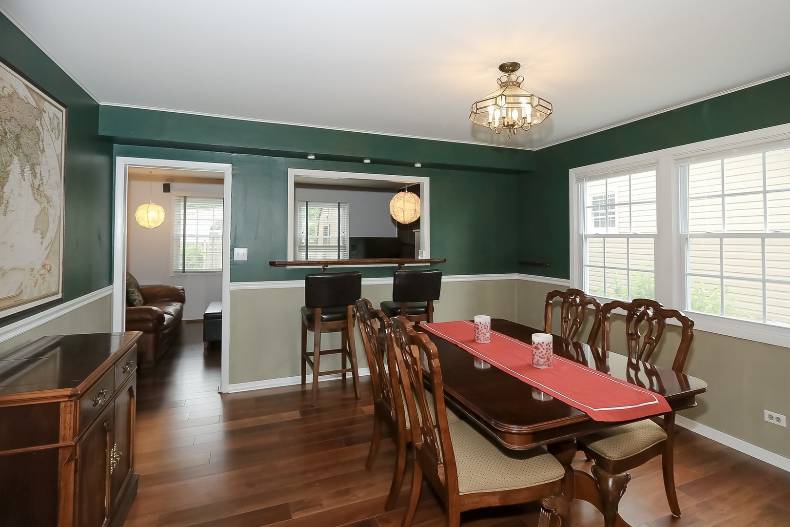 136 Weidner Road Buffalo Grove, IL 60089 - Photo 8 of 41 a view of a dining room with furniture window and wooden floor