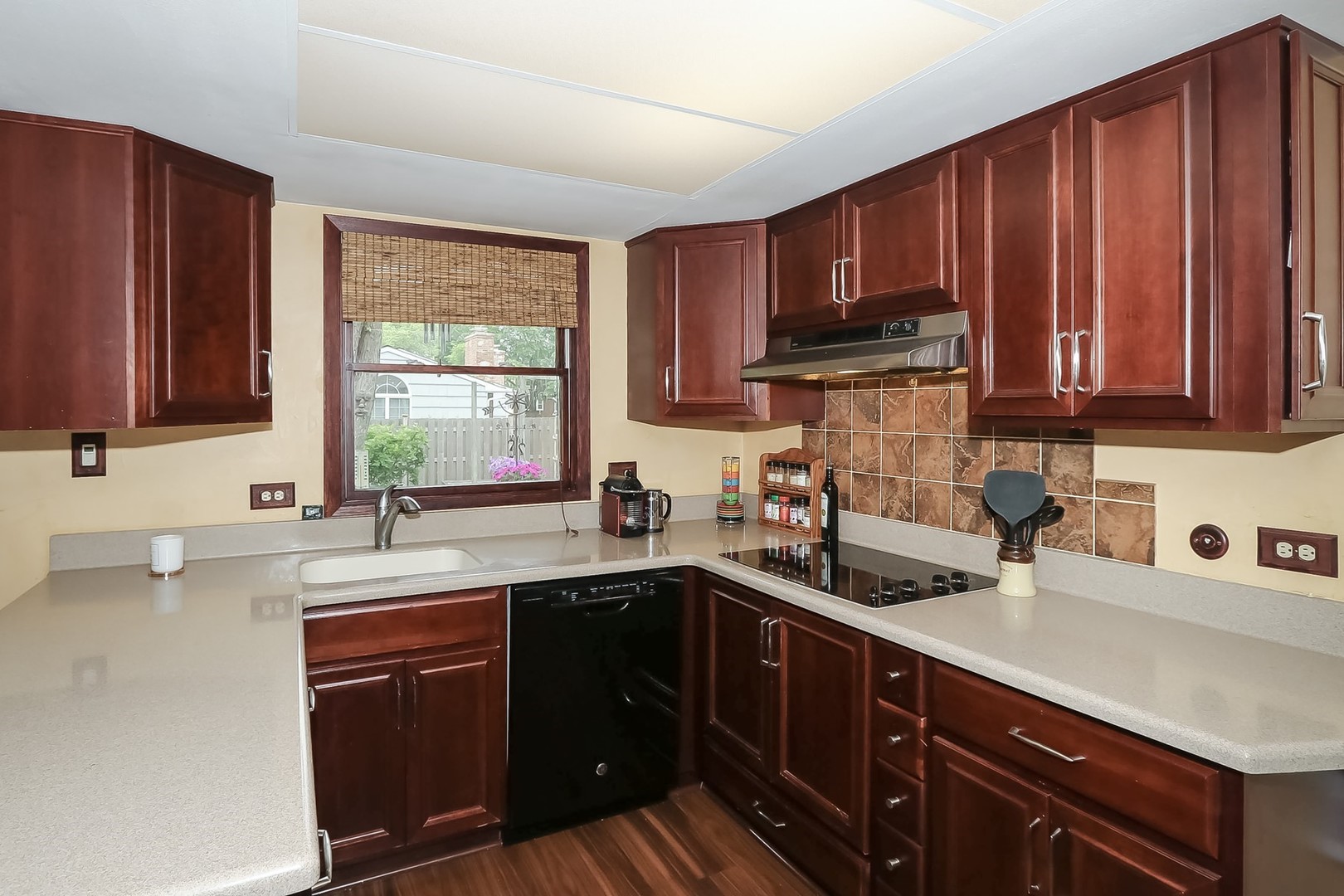 136 Weidner Road Buffalo Grove, IL 60089 - Photo 9 of 41 a kitchen with stainless steel appliances granite countertop wooden cabinets a sink and dishwasher