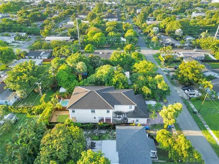 an aerial view of house with yard