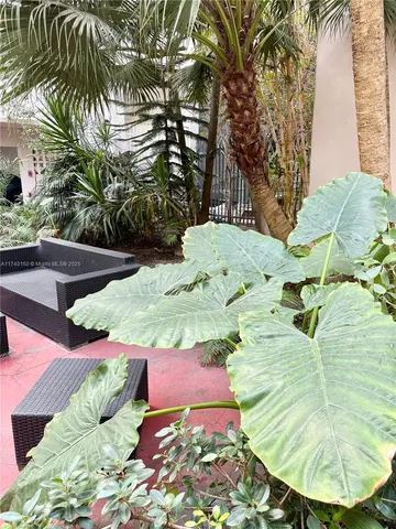 a view of swimming pool with a table and chairs