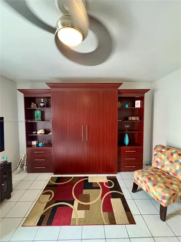 a bedroom with a bed and a table