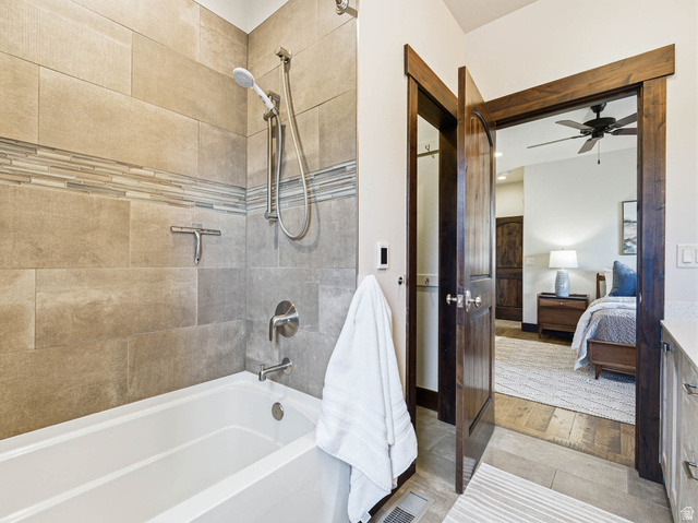402 Shadow Hill Road Wanship, UT 84017 - Photo 35 of 90 Bathroom with shower / bathtub combination, ensuite bathroom, a ceiling fan, and light tile patterned floors
