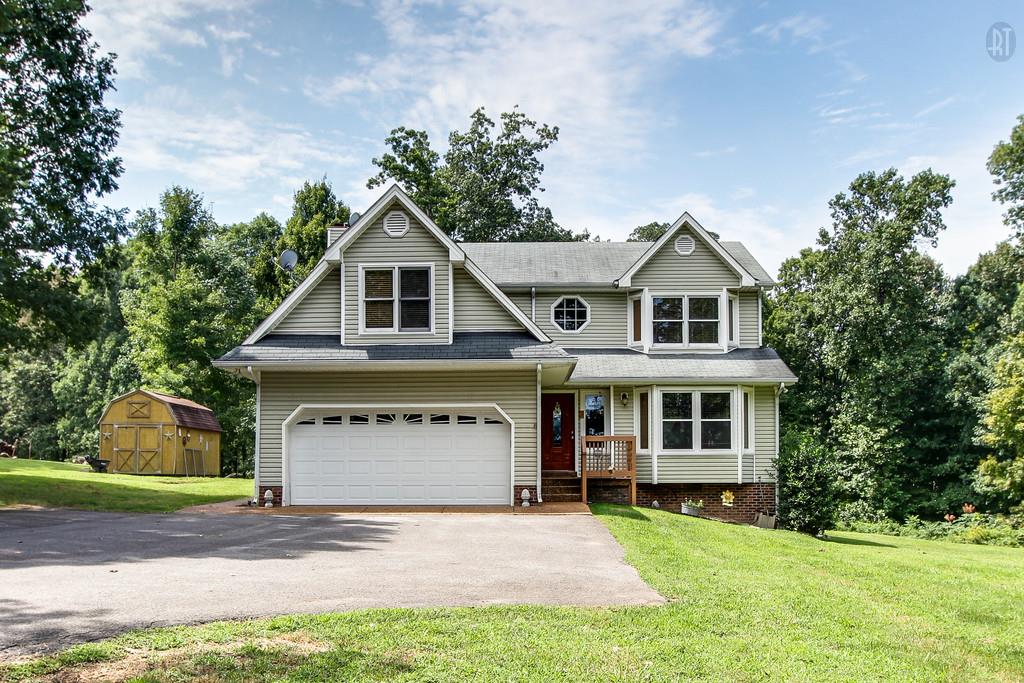 5909 Parham Road Franklin, TN 37064 - Photo 1 of 23 a view of a house with a yard and large tree