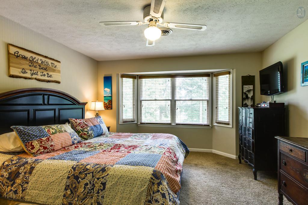 5909 Parham Road Franklin, TN 37064 - Photo 13 of 23 a bedroom with a large bed and a large window