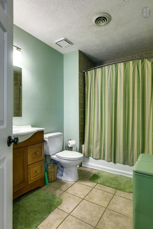 5909 Parham Road Franklin, TN 37064 - Photo 18 of 23 a bathroom with a toilet sink and mirror