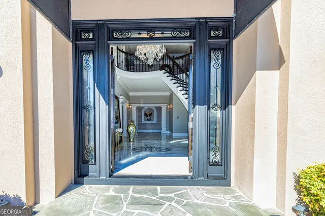 a view of entryway and hall with wooden floor