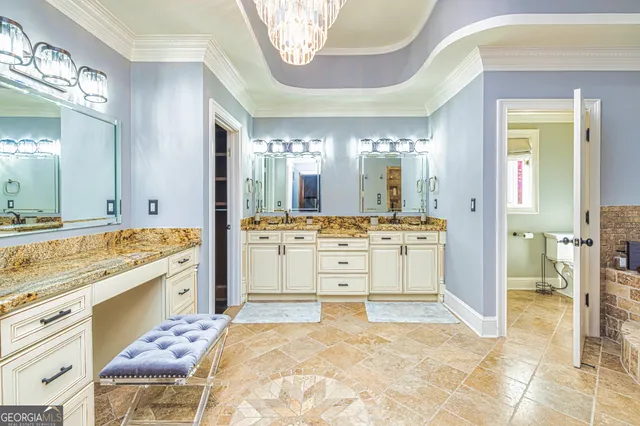 a bed sitting in a spacious bedroom next to a window