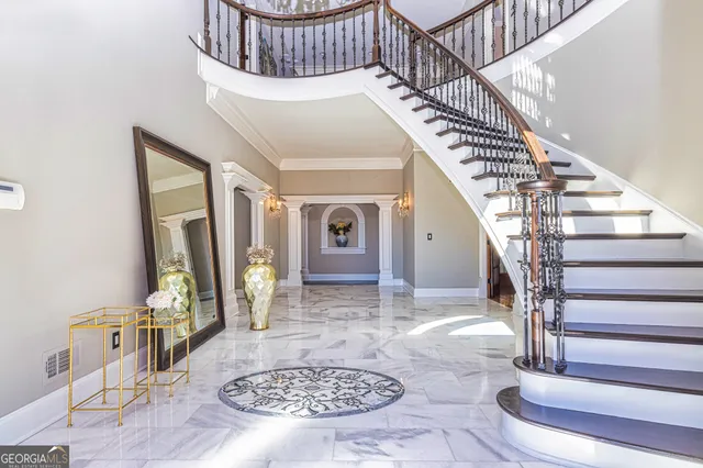 a living room with fireplace furniture and a large window