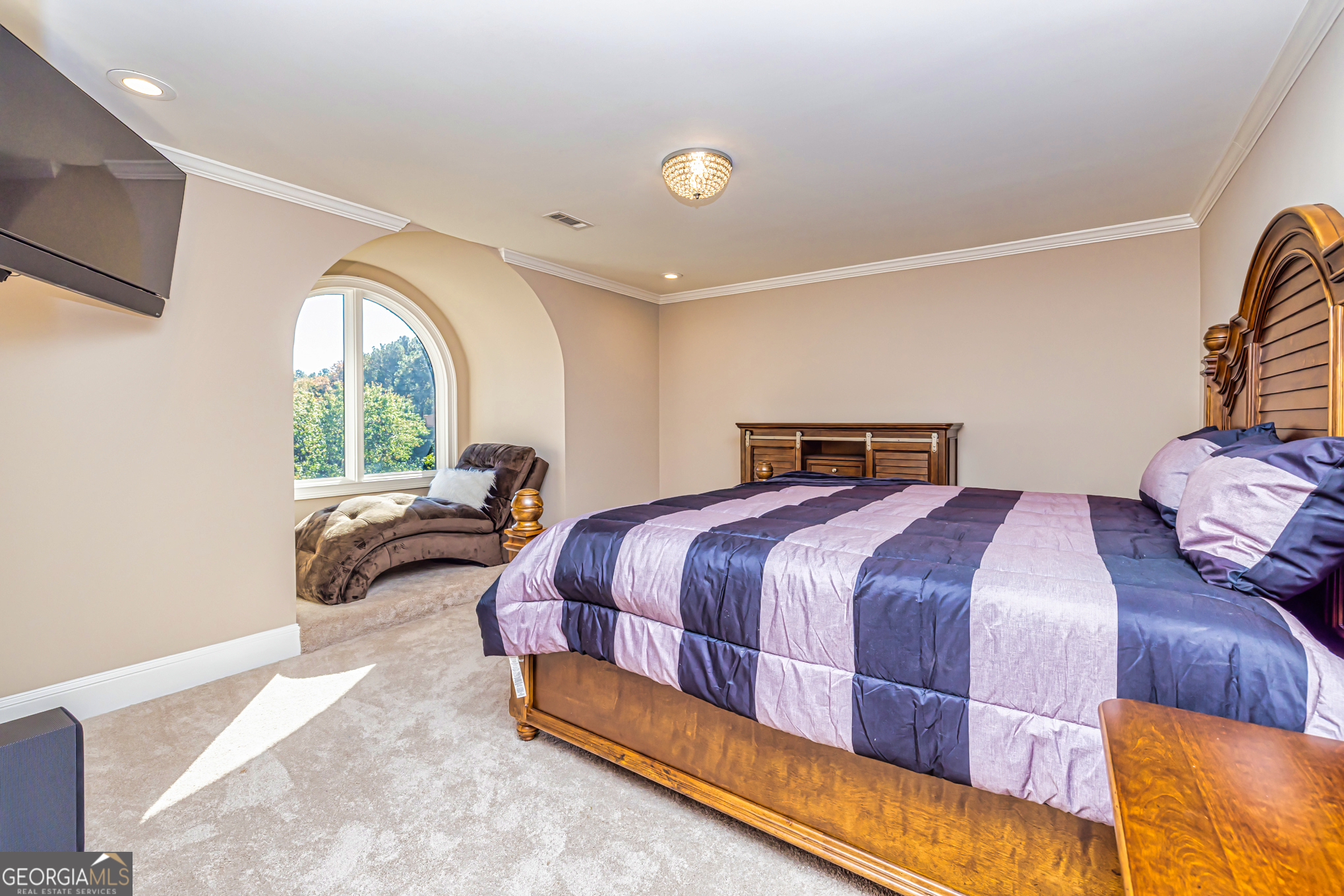 131 Lincoln Road Tyrone, GA 30290 - Photo 52 of 82 a bedroom with a bed and a large window