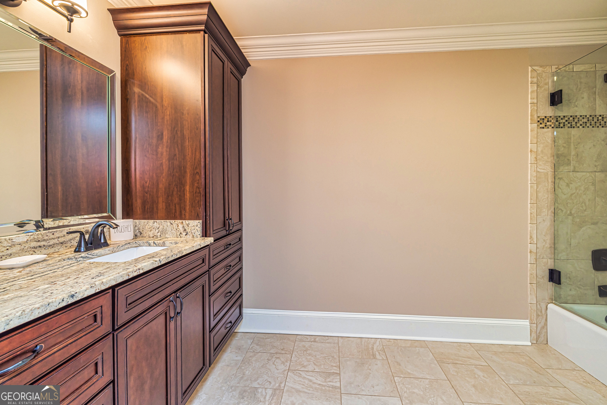 131 Lincoln Road Tyrone, GA 30290 - Photo 56 of 82 a bathroom with a granite countertop sink and a mirror
