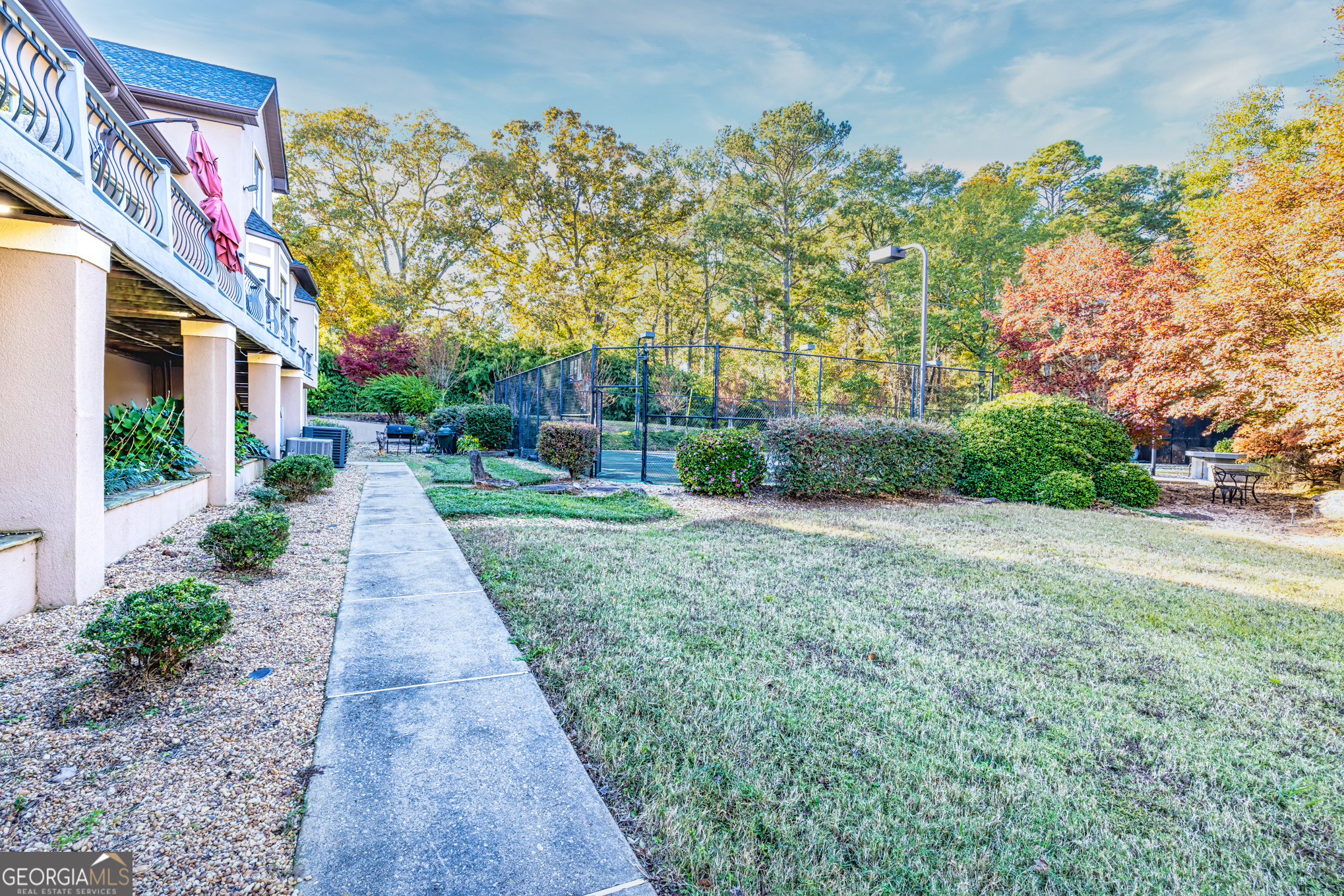 131 Lincoln Road Tyrone, GA 30290 - Photo 71 of 82 a view of a pathway with a house in the background