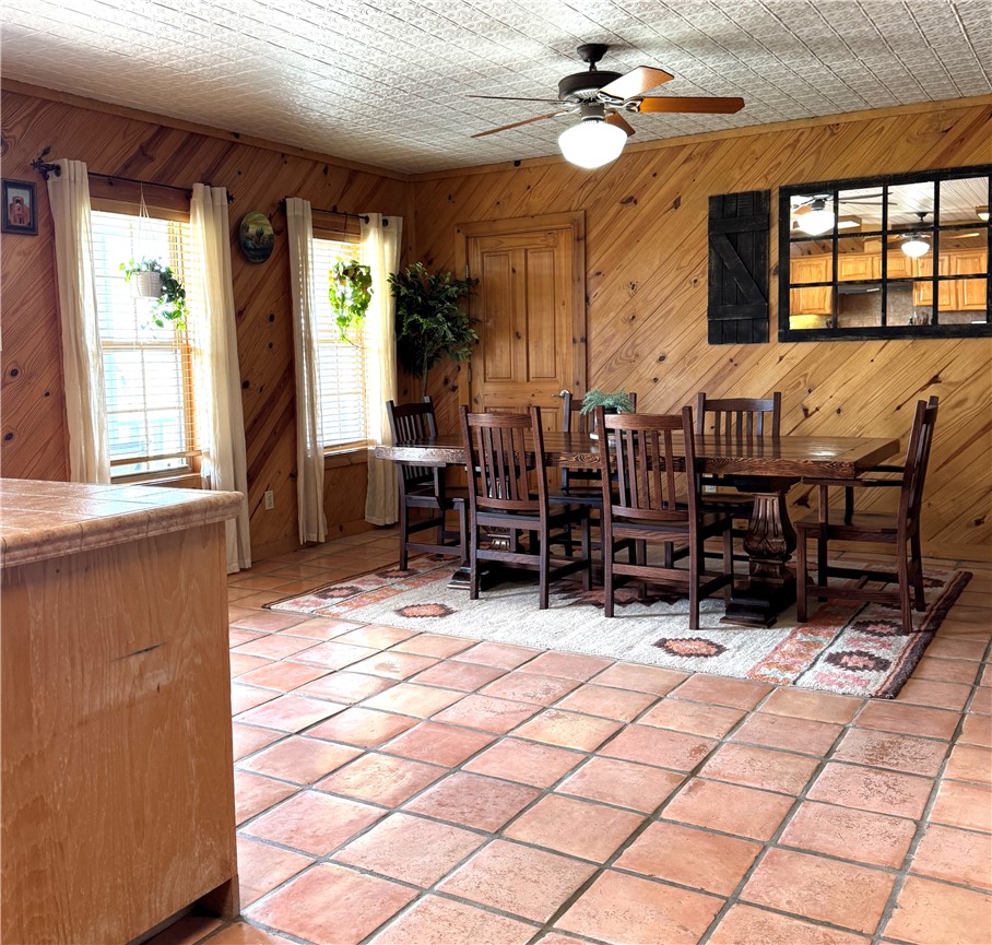 5567 County Road 1441 Mathis, TX 78368 - Photo 15 of 28 a room with lots of chairs and a chandelier