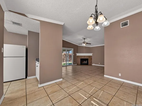 a view of an empty room with a fireplace