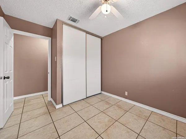 an empty room with wooden floor