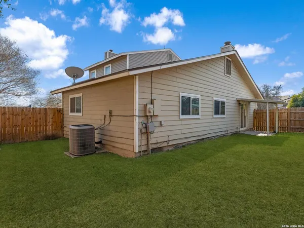 a view of a backyard with plants and a garden