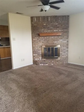 a living room with a fireplace