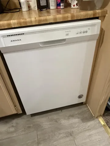 a stove top oven sitting inside of a kitchen