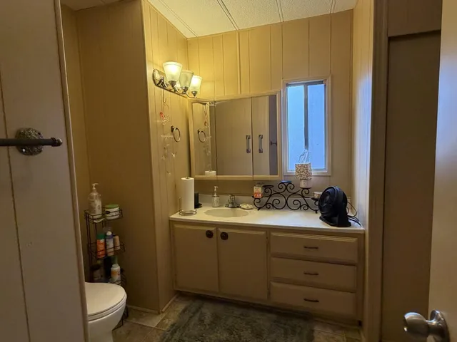 a porch with chairs and a table