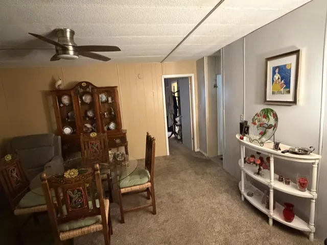 a kitchen with refrigerator and white stove