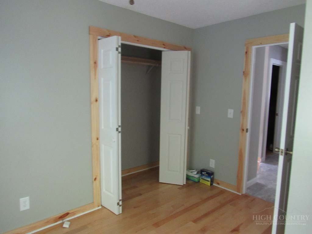 805 Ed Little Road Warrensville, NC 28693 - Photo 43 of 49 an empty room with closet