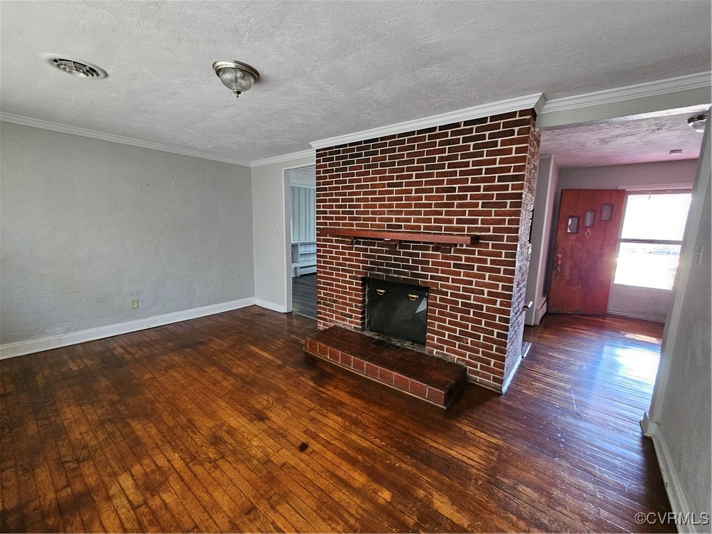 4010 Dill Road Richmond, VA 23222 - Photo 5 of 12 a view of an empty room with wooden floor fire place and a window