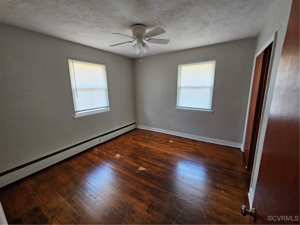 4010 Dill Road Richmond, VA 23222 - Photo 8 of 12 a view of an empty room with wooden floor and a window