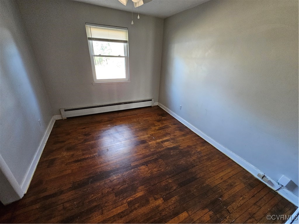4010 Dill Road Richmond, VA 23222 - Photo 9 of 12 an empty room with wooden floor and windows