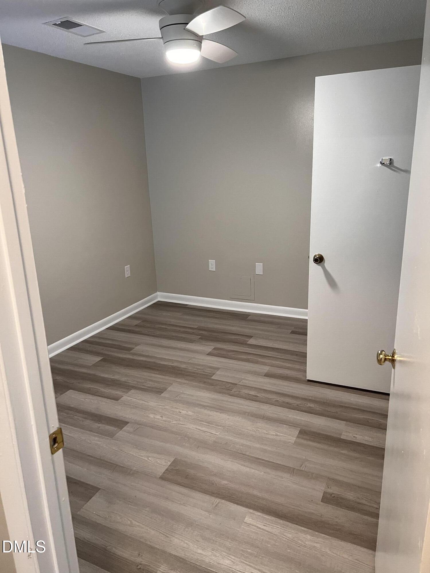 1431 Collegiate Circle, Unit 101 Raleigh, NC 27606 - Photo 7 of 11 a view of an empty room