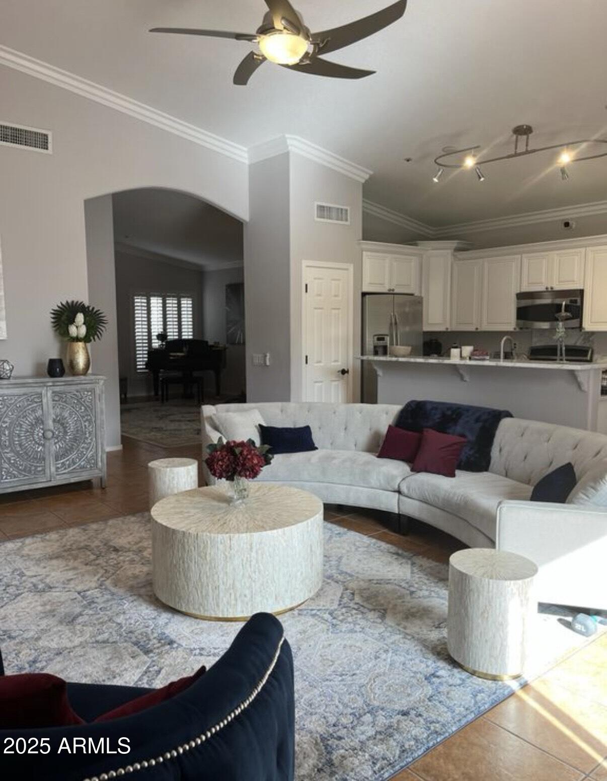 a living room with furniture and kitchen view