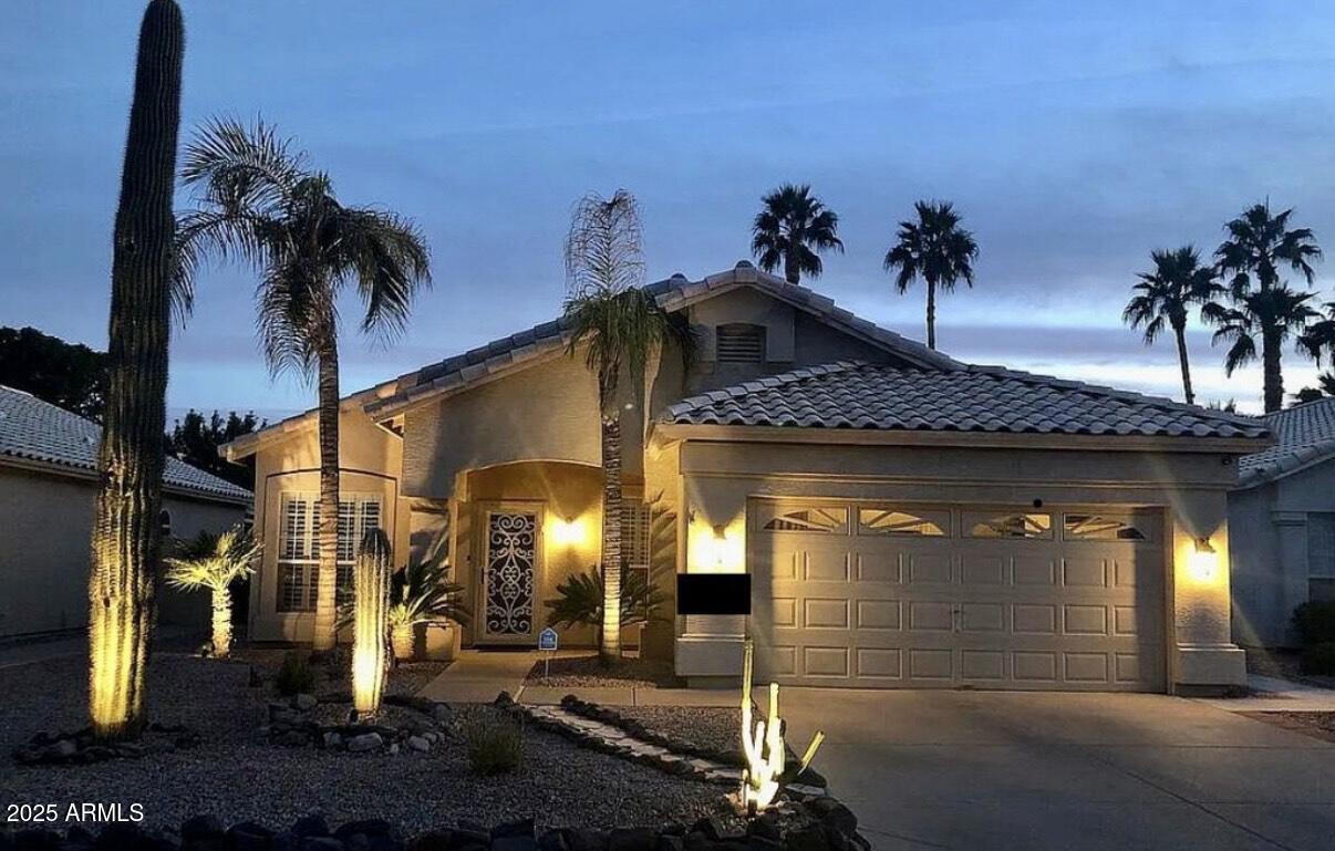 9233 East Blanche Drive Scottsdale, AZ 85260 - Photo 2 of 13 a front view of a house with plants