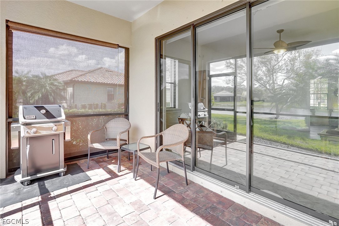 10879 Rutherford Road Fort Myers, FL 33913 - Photo 21 of 36 a living room with a large window and furniture