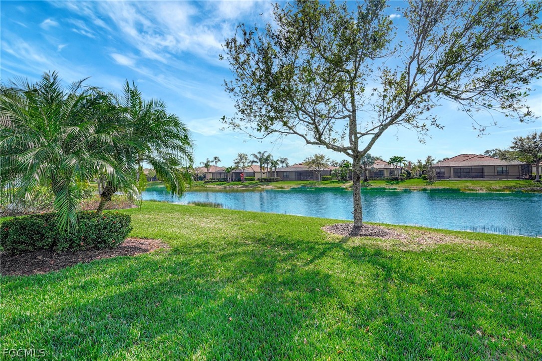 10879 Rutherford Road Fort Myers, FL 33913 - Photo 23 of 36 a view of a lake with houses in the back