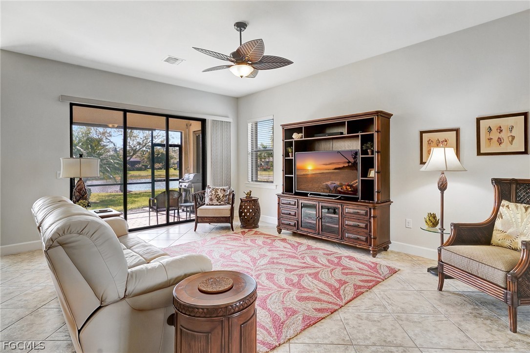 10879 Rutherford Road Fort Myers, FL 33913 - Photo 5 of 36 a living room with furniture and a flat screen tv