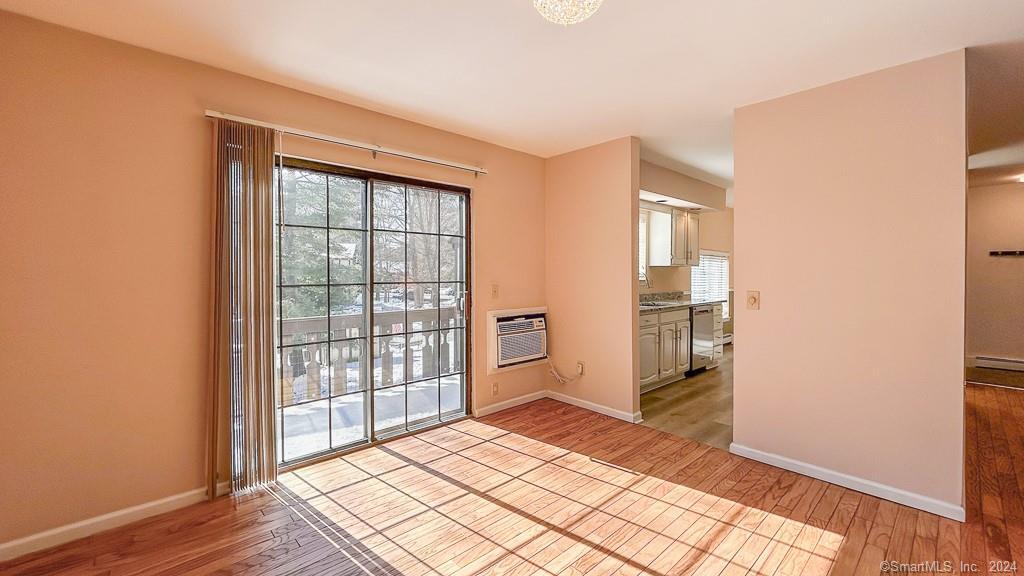 8 Derby Court, Unit 8 Brookfield, CT 06804 - Photo 12 of 26 a view of empty room with wooden floor and fan