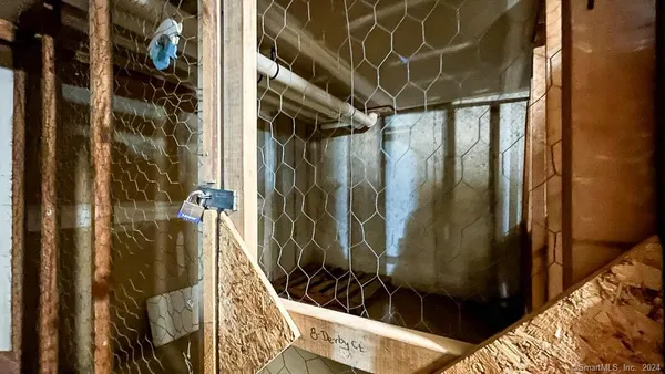 a backyard of a house with barbeque oven and outdoor seating