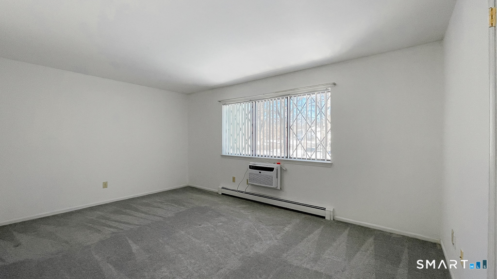 8 Derby Court, Unit 8 Brookfield, CT 06804 - Photo 17 of 26 an empty room with a window