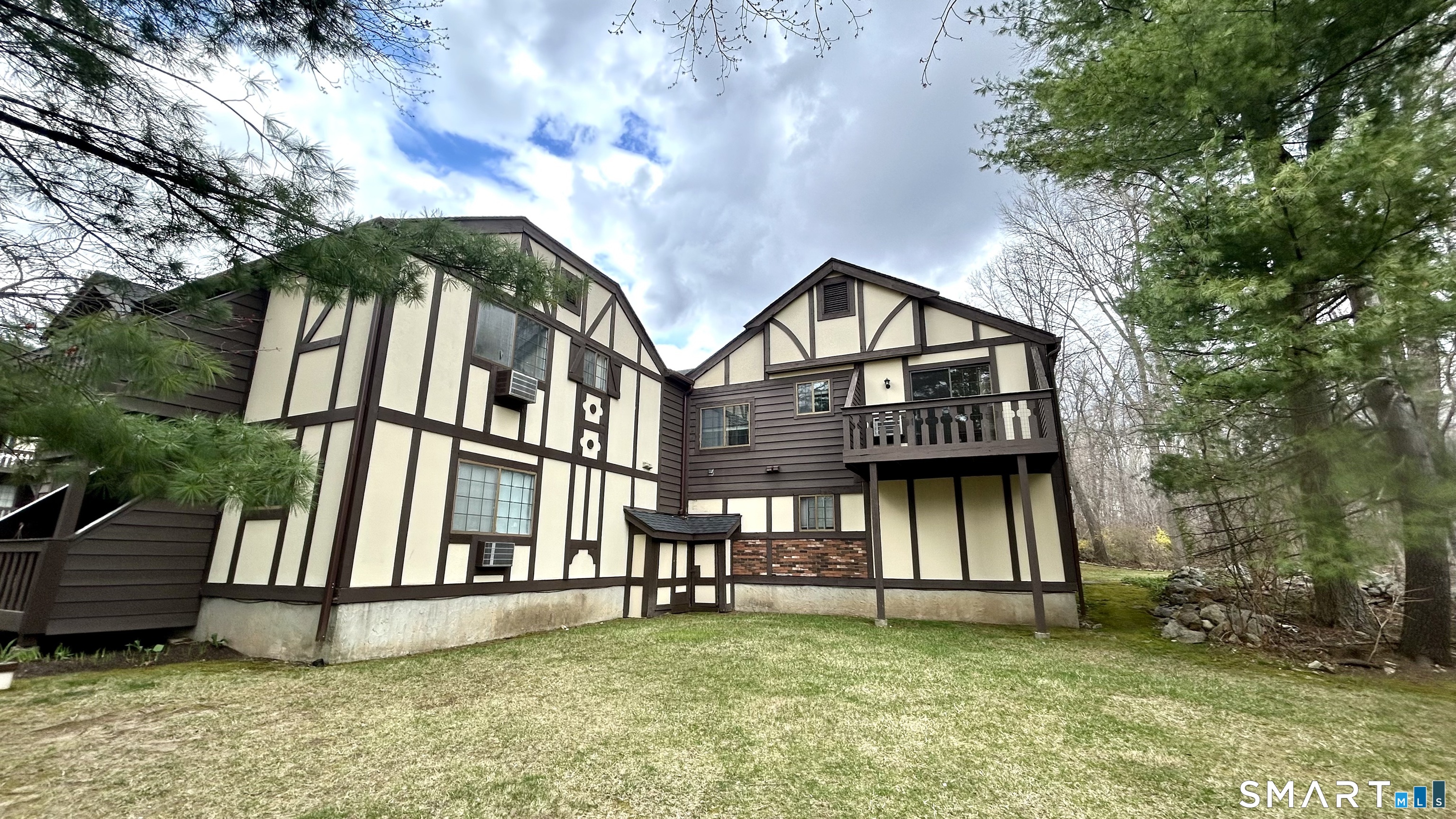 8 Derby Court, Unit 8 Brookfield, CT 06804 - Photo 2 of 26 a view of a house with a yard and a fountain