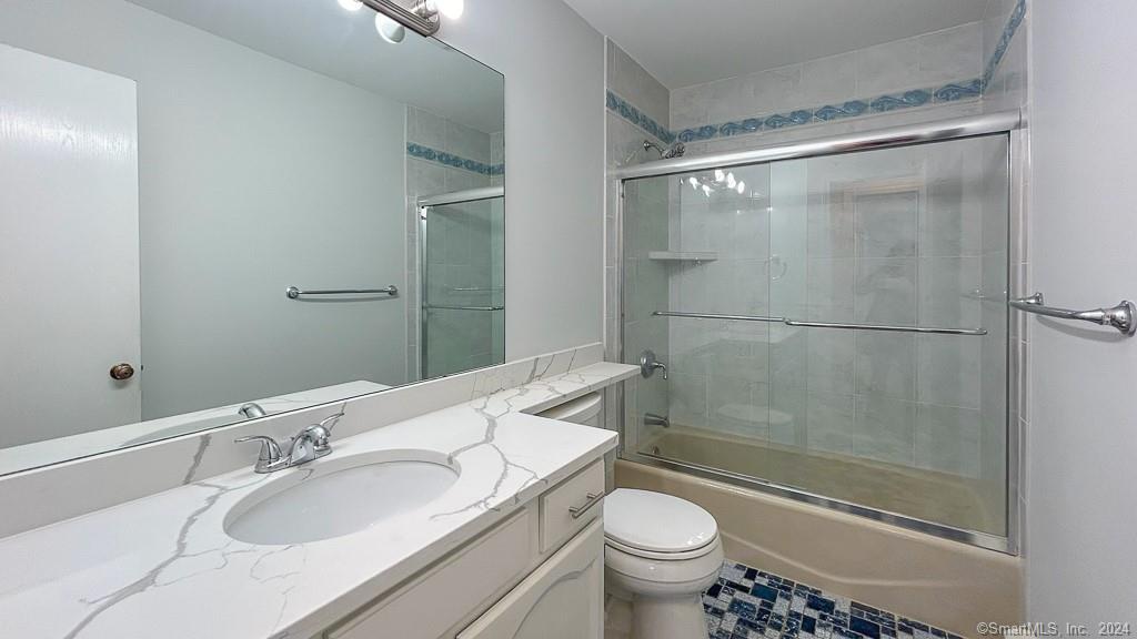 8 Derby Court, Unit 8 Brookfield, CT 06804 - Photo 21 of 26 a bathroom with a sink and a mirror