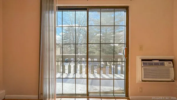 a view of a glass door and balcony