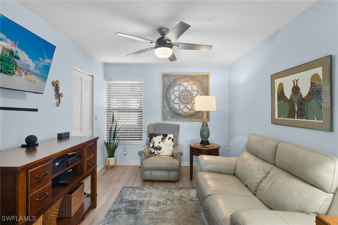 5925 Trailwinds Drive, Unit 912 Fort Myers, FL 33907 - Photo 12 of 39 a living room with furniture and a window