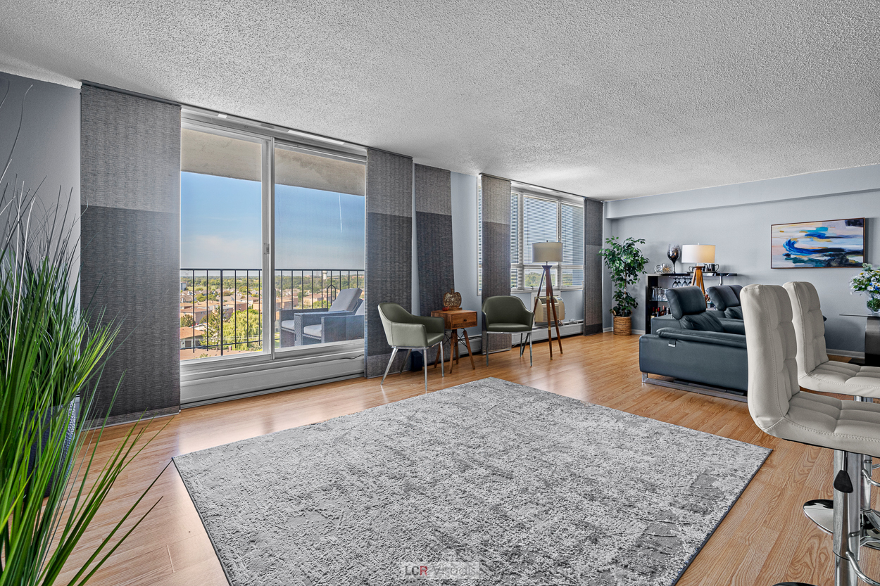 8815 West Golf Road, Unit 10C Niles, IL 60714 - Photo 13 of 27 a living room with furniture and wooden floor
