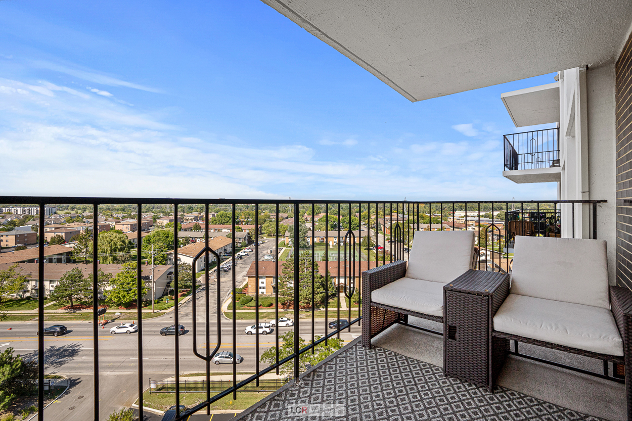8815 West Golf Road, Unit 10C Niles, IL 60714 - Photo 15 of 27 a balcony with a floor to ceiling window