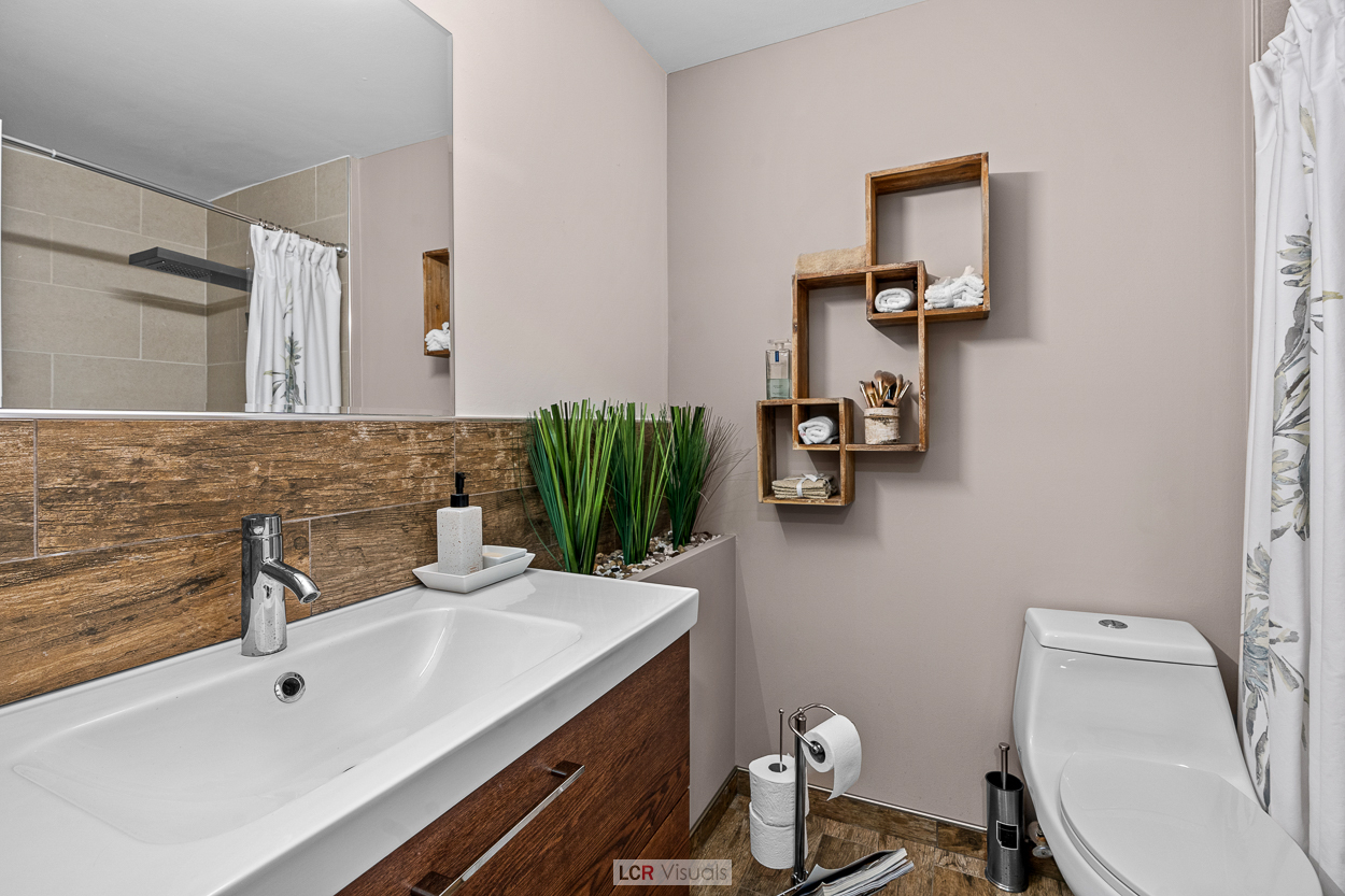 8815 West Golf Road, Unit 10C Niles, IL 60714 - Photo 16 of 27 a bathroom with a sink and a mirror