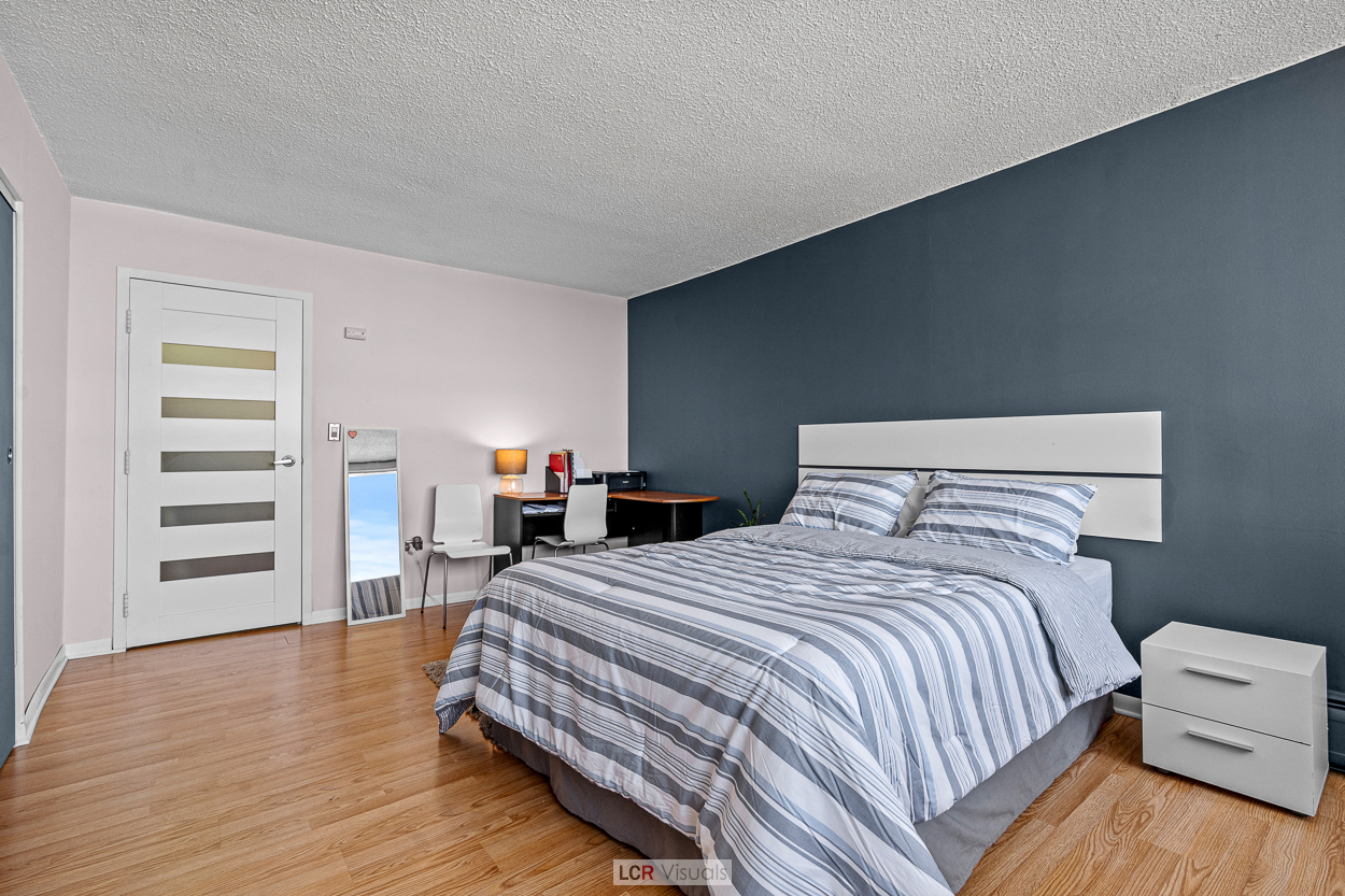 8815 West Golf Road, Unit 10C Niles, IL 60714 - Photo 19 of 27 a bedroom with a bed and a view of dresser