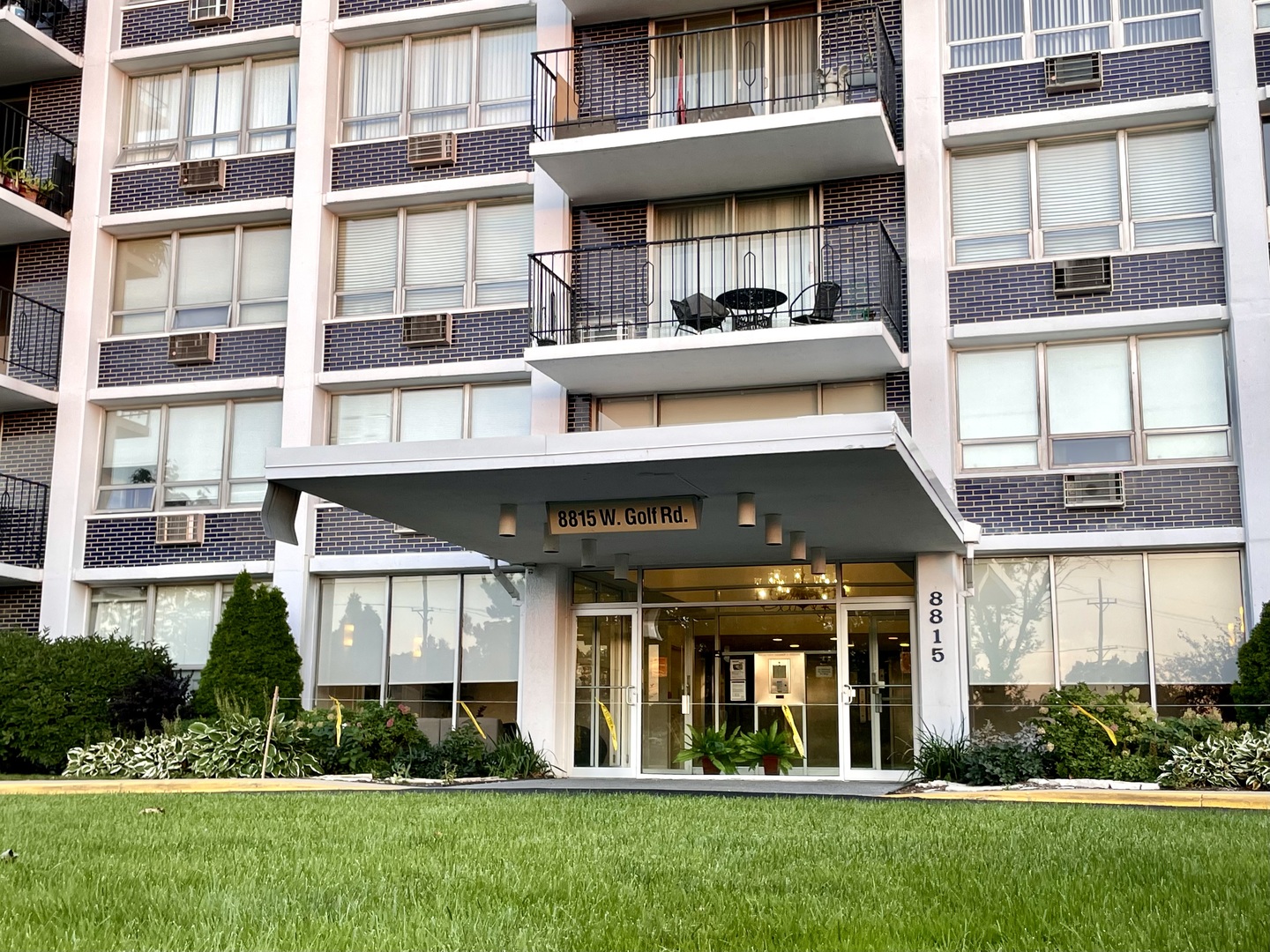 8815 West Golf Road, Unit 10C Niles, IL 60714 - Photo 25 of 27 a front view of a building with a garden