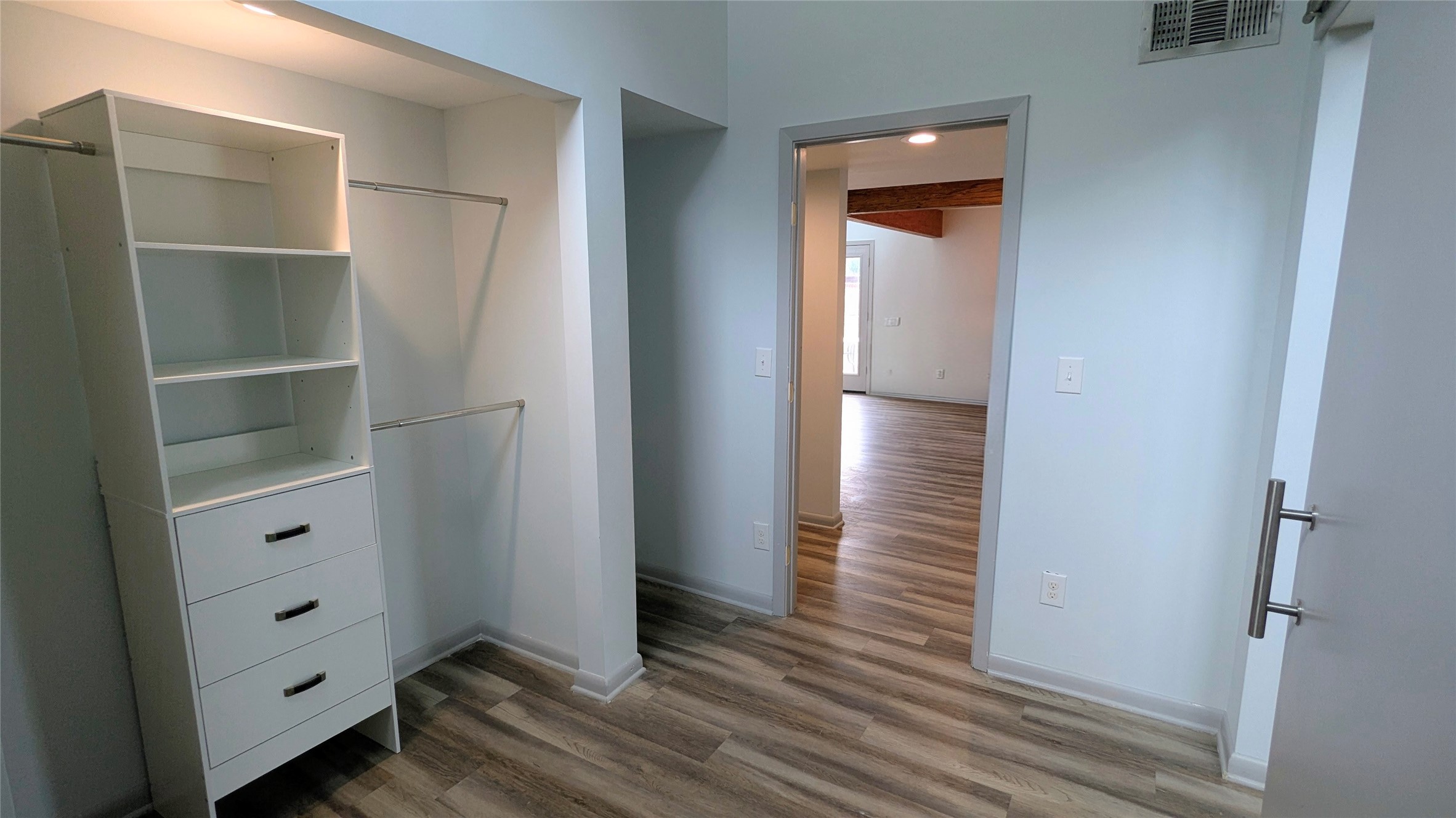 4505 Teri Road, Unit A Austin, TX 78744 - Photo 13 of 23 Custom built-ins and ample hanging space create an organized walk-in closet.