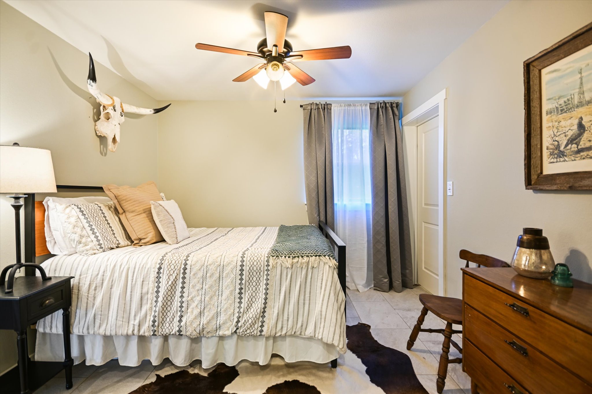 2411 Spoke Hollow Road Wimberley, TX 78676 - Photo 31 of 37 Relaxation awaits in this bedroom, featuring neutral walls and abundant natural light.