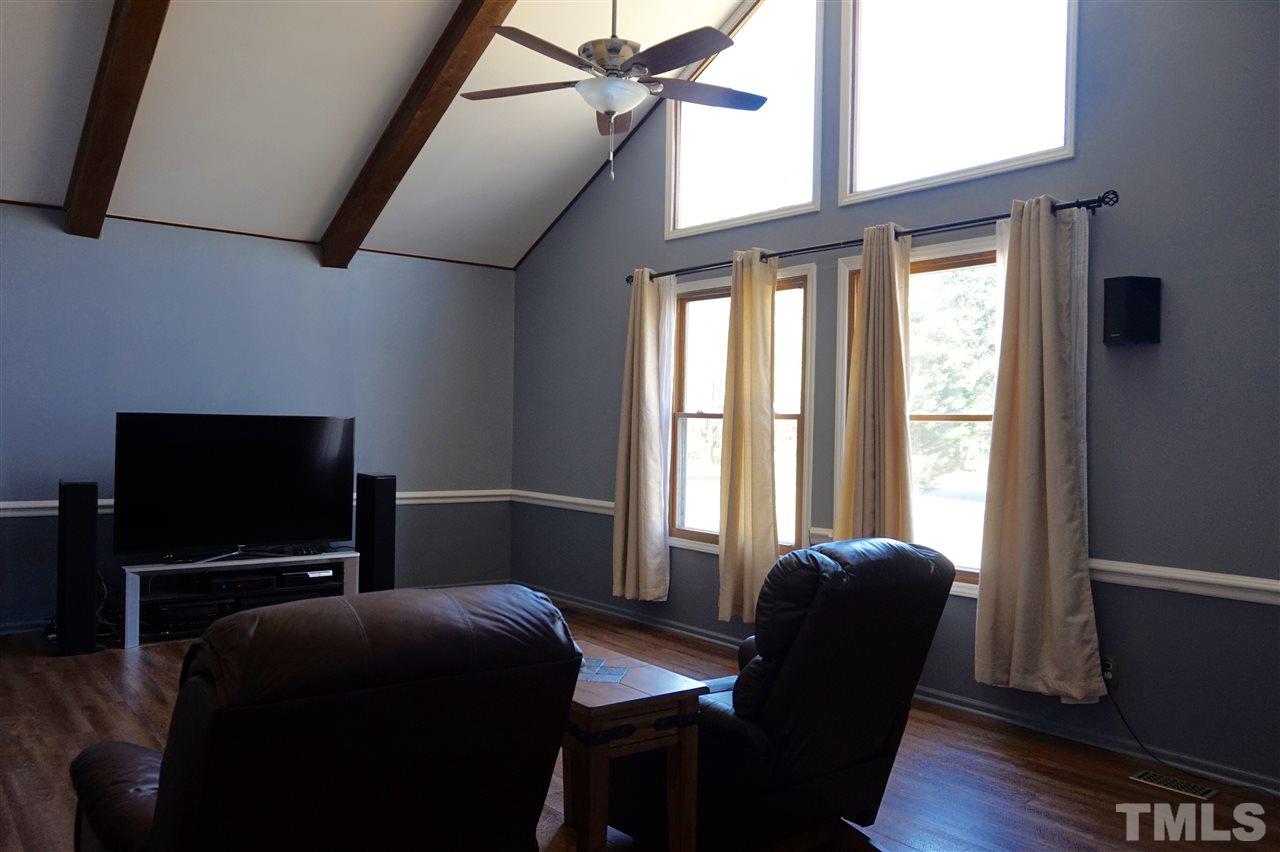 8605 Maidstone Court Raleigh, NC 27613 - Photo 3 of 13 a bedroom with furniture and windows