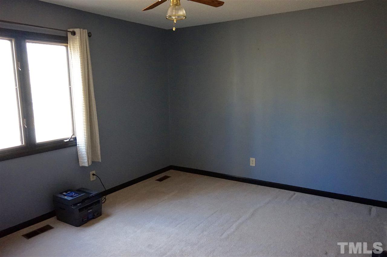 8605 Maidstone Court Raleigh, NC 27613 - Photo 9 of 13 an empty room with a window
