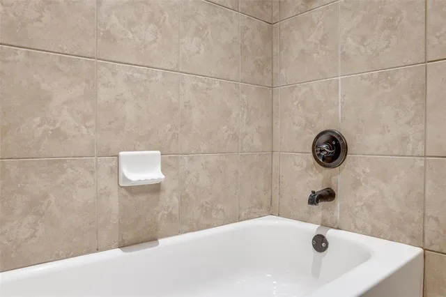 a bathroom with a white bath tub